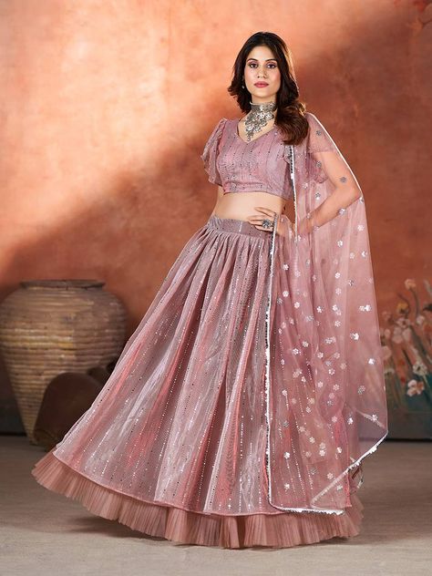 Make a statement with Shop Garb's Mauve Pink Sequins Embroidered Lehenga Choli. This ensemble exudes elegance with its unique embroidery and sequin work, perfect for weddings and ceremonial occasions. The circular net lehenga in mauve pink is complemented by a matching net blouse adorned with intricate embroidery. Complete the look with the solid bordered net dupatta for a touch of sophistication." Mauve Pink Lehenga, Lehenga For Party, Pink Sequin Lehenga, Sequins Lehenga Choli, Sequin Lehenga, Sequin Material, Antique Jewellery Online, Net Blouses, Net Lehenga