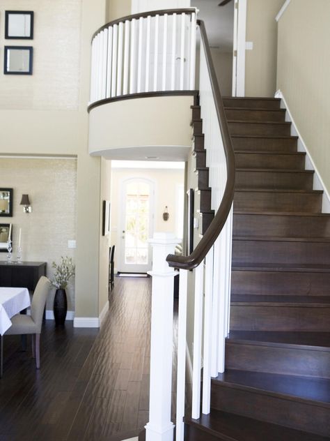 Dark brown wood stairs compliment the chocolate brown handrail and pop against the white banisters. Dark Wood Floors Living Room, Light Walls, Painted Staircases, Living Room Wood Floor, Hardwood Stairs, Grey Wood Floors, Traditional Staircase, Decor Ikea, Dark Wood Floors