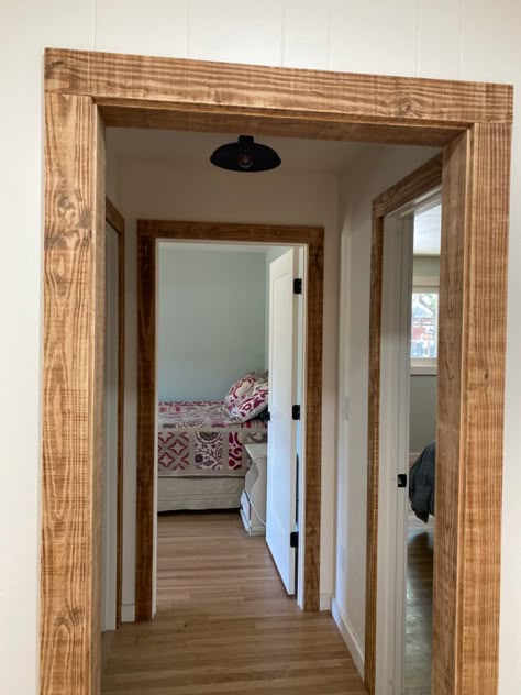 Faux Wood Cased Opening, Stained Baseboards And Trim Farmhouse, Wood Trim Cased Opening, Cedar Trim Interior, Rustic Wood Cased Opening, Wood Door Casing, Pine Doors With White Trim, Barnwood Door Trim, Rustic Door Trim