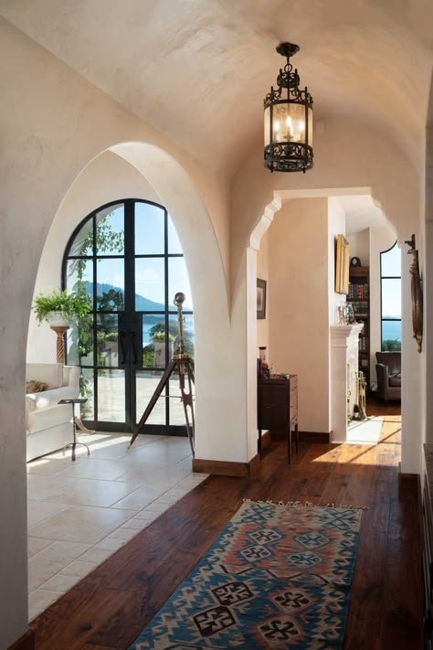 View of the home from the lower portion of the property shows a variety of building forms and architectural openings. Some interesting details highlight the quality of the construction. — Tom Meaney | Architect California Premier Architect Serving Santa Barbara, Montecito, Carmel, Pebble Beach, Ojai, Marin, and Monterey Santa Barbara Interior Design, Santa Barbara Architecture, Coastal Mediterranean Decor, California Mediterranean Homes, Coastal Interior Design Style, Santa Barbara Style Interiors, Posh House, Classic Beach House, Santa Barbara Style Homes