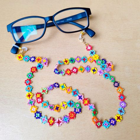 This unique eyeglass chain is meticulously hand-woven from the highest quality glass seed beads, the cute glasses chain you can wear all season long, the boho glasses chain is guaranteed to receive all the compliments. Lenght 80 cm inches 31,5 in                                                                                                                                                  The perfect womens sunglass strap is guaranteed to receive all compliments and your glasses will never be lo Glasses Strap Beads, Boho Glasses, Eyeglasses Chains, Unique Eyeglasses, Sunglass Strap, Colorful Glasses, Glasses Necklace, Eyeglasses Chain, Eyeglass Strap