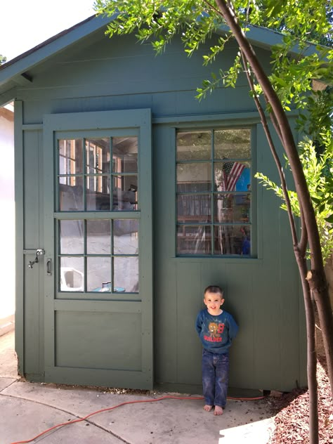 Our shed to greenhouse diy conversion using antique windows, and painted this dark moody green from Behr: North Woods. The closest thing we could find to the shade of the pine trees behind our house! Shed To Greenhouse, Behr North Woods, Green Shed, Green Exterior House Colors, Greenhouse Diy, Painted Shed, Moody Green, Luxury Living Room Decor, Shed Colours