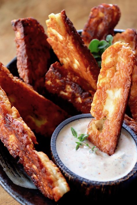 Halloumi Fries are an unexpected and absolutely scrumptious appetizer, snack or side dish. With an inherently tangy-salty flavor, they have a crispy caramelized crust and a soft and creamy interior. When you dip them in the sweet and spicy Greek yogurt dip, you might love them even more! #fries #halloumi #halloumifries #cheesefries #yougrtdip #Greekyogurtdip Halloumi Fries, Greek Fries, Haloumi Cheese, Vegetarian Party, Vegetarian Party Food, Fried Halloumi, Healthy Potato Recipes, Meat Snacks, Yogurt Dip