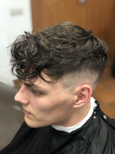 Long curly fringe and a skinfade Messy Fringe Haircut Men Curly, Mid Taper Textured Fringe Men, Men’s Messy Fringe, Front Fringe Hairstyles Men, Messy Fringe Haircut Men Fade, Curly Fringe Hairstyles Men, Fridge Haircut Men, Heavy Fringe Men, Textured Fringe Mid Taper