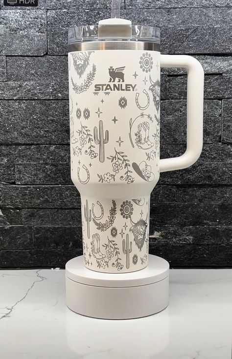 (shown in Sour Cream) This western design features cacti, highland cows, and cowgirl boots for a beautiful country vibe!  Authentic 40oz Stanley Quencher w/straw.  To add personalization, add "Personalize Your Stanley" listing to your cart with tumbler. Our designs and texts are precisely etched using LASER technology, not vinyl, ensuring they stand the test of time. Each tumbler has a lid and straw and is brand new, with the tag removed only for engraving. For optimal durability, we recommend h Country Stanley Cup, Pickle Stanley Cup, Western Stanley Cup, Western Stanley, Western Cups, Cute Stanley, Country Birthday Party, Stanley Mug, Cowgirl Room