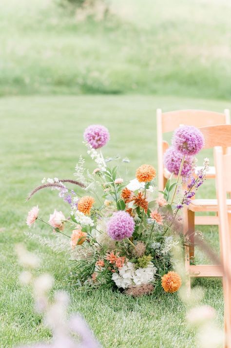 Whimsical aisle meadow pieces from A & A 's summer wedding at Spruce Mountain Ranch in Larkspur, Colorado. Photo @BritniGirard Wedding Florals Whimsical, Wildflower Ceremony Aisle, Mountain Spring Wedding, Meadow Centerpiece, Flower Meadow Wedding, Aisle Meadow, Summer Wedding Aisle, Ceremony Aisle Flowers, Wild Wedding Flowers