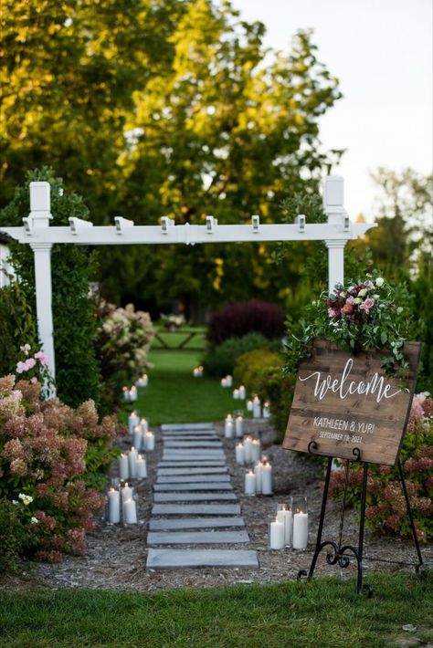 Walkway through flowers lit with candles and a welcome sign. Tablescape with wood chairs and green, blush, and burgundy details. Outdoor cigar station in the grass with white house as a backdrop. Magic Photography, Events Planning, July Wedding, Wedding Planning Services, Wine Wedding, Northern Michigan, Wedding Boutique, Wedding Event Planning, Deep Love