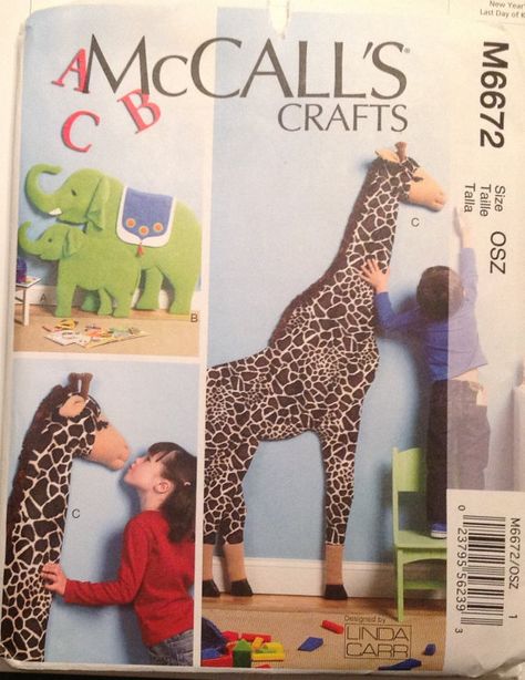 Giraffe Elephant wall decoration  McCalls by LuckyCarolDesigns, $5.21 Giraffe Sewing Pattern, Giraffe Fabric, Giraffe Crafts, Elephant Wall Decor, Childrens Wall Decor, Sewing Templates, Animal Wall Decor, Kids Wall Decor, Mccalls Sewing Patterns