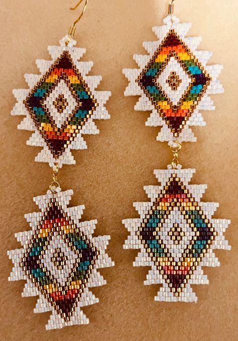 Beaded Southwestern style design Dangle Earrings made with Czech seed beads sparkling rainbow white beads.  Make any outfit beautiful! Beaded Western Earrings, Seed Beaded Earrings, Handmade Beaded Earrings, Native Beaded Earrings, Delica Beaded Earrings, Indigenous Beaded Earrings, Native American Beadwork Earrings, Brick Stitch Pattern Earring, Beaded Banners