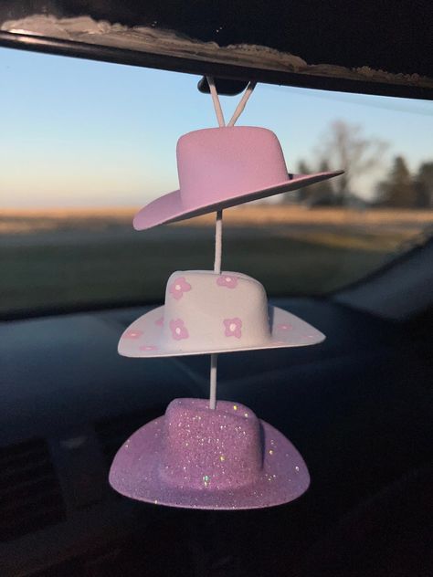 Cute western car charm that can be used to put around your rear view mirror or hang up anywhere to add a little decoration. Cowboy Hat Mirror Hanger, Cowboy Hat Decorating, Mini Cowboy Hat, Mini Cowboy, Market Day Ideas, Western Car, Mirror Hangers, Cowgirl Hats, Car Stuff