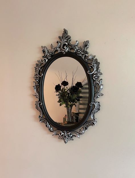 🖤DESCRIPTION: This gorgeous ornate vintage black mirror conjures up images of fairytales and enchanted forests - it would make a phenomenal gallery wall centerpiece! This is a vintage Mirror. The frame has been painted a flat black and then distressed with Silver Leaf wax. The detail on the frame is phenomenal! The frame has been sealed with a clear enamel coat. 3rd picture is with an adult male to give you an idea of size. This is the perfect focal mirror for that gallery wall or for your Vict Gothic Noir Decor, Gothic Picture Frames, Gothic Mirror Frame, Black Vintage Mirror, Goth Mirror, Mirror Snow White, Gallery Wall Mirror, Vintage Gothic Decor, Vintage Gothic Home Decor