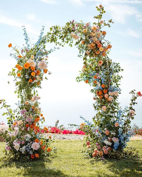 Wildflower Trellis Wedding, Wild Flower Reception, Wedding Arch Flowers Wildflowers, Outdoor April Wedding, Floral Half Arch Wedding, Colorful Wedding Altar, Beach Floral Wedding, Spring Wedding Isles Decoration, Spring Garden Color Palette