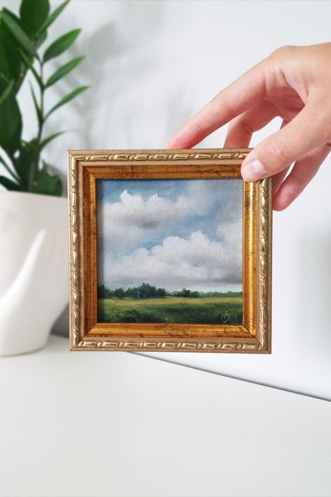 Introducing a stunning miniature landscape painting that will instantly transport you to a serene world of natural beauty. This exquisite artwork is carefully crafted on a canvas panel, capturing the essence of a picturesque landscape. The gold frame elegantly complements the painting, adding a touch of sophistication to any space. Display it on your mantel, shelf, or gallery wall to create an enchanting focal point that will captivate everyone who lays eyes upon it. Small Painting Big Frame, Small Framed Paintings, Framed Paintings On Wall, Small Oil Paintings, Tiny Paintings Ideas, Mini Landscape Paintings, Small Art Gallery, Miniature Landscape Painting, Miniature Art Painting