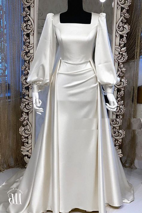 Another bridal silk dress looks so chic for any bride. You’ll love that if you’re going for something classic. Add that to your silk dress faves. White Long Sleeve Satin Dress, Modest Reception Wedding Dress, Modest Engagement Dress, Long Bridal Gown, Modest Bridal Gowns, Modest Evening Dress, Modest Bridal, Women Dresses Classy, Modest Dresses Casual