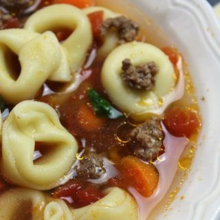 Hamburger Tortellini Soup with carrots and tomatoes in a white bowl with crackers Tortellini Hamburger Recipes, Crock Pot Tortellini, Cheese Tortellini Soup, Italian Sausage Soup, Gluten Free Puff Pastry, Hamburger Soup, Tortellini Recipes, Pork Meatballs, Sausage Soup