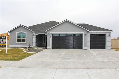 Top 5 Color Choices for Garage Doors Gray House White Trim, Grey Stucco House Exterior, Grey House White Trim, Grey Garage Doors, Black Garage Door, Black Garage Doors, White Garage Doors, Garage Door Colors, Garage Door Paint