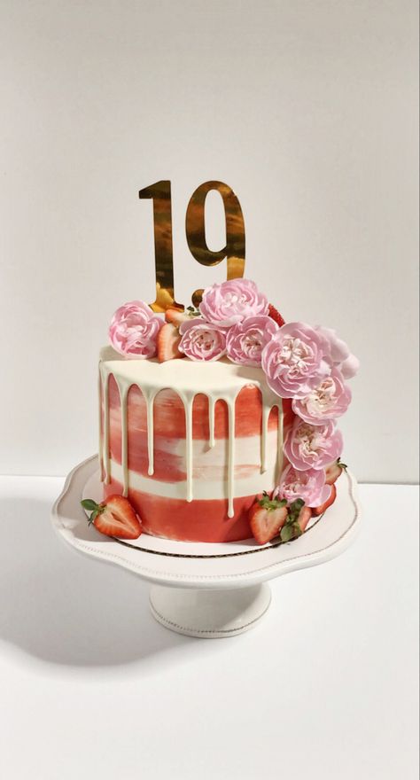 Red and white cake with white drip. There are cascading pink carnations and strawberries all along the cake. The gold topper on the top left reads “19”. Red And White Cake, Birthday Makeup Ideas, 19th Birthday Cake, 19th Birthday Cakes, Happy 19th Birthday, Red Cake, Birthday Makeup, 19th Birthday, Pink Carnations