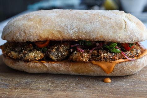 Call it a schnitzel or a giant nugget, this breadcrumb coated aubergine goes perfectly with harissa mayo and herby salad in our first sarnie drop of the season. We’ve managed to turn one whole aubergine into a cutlet by roasting, steaming and peeling off the skin. Inspired by the technique for making baba ganoush, this is the best way to get your inner schnitzel soft and juicy Bosh Recipes, Harissa Mayo, Herby Salad, Schnitzel Sandwich, Chinese Lemon Chicken, Roast Pumpkin Soup, Curry Stew, Eggplant Salad, Harissa Paste