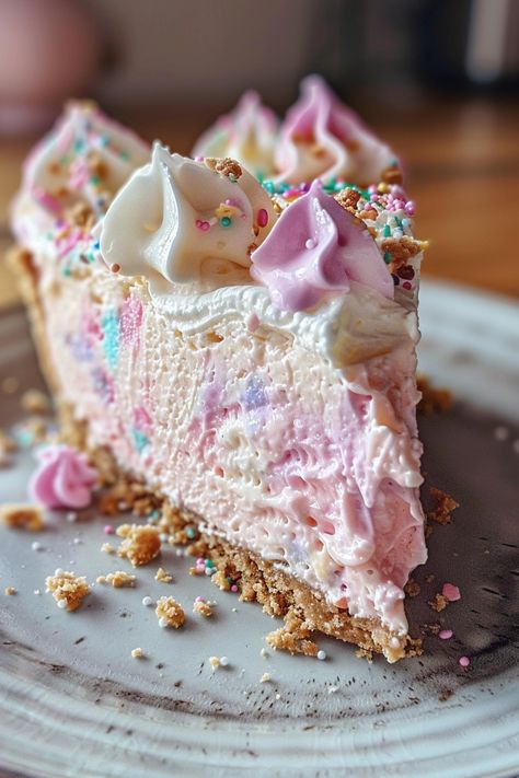 🍬 🍭  Cotton Candy Cheesecake 🍬 🍭  This whimsical Cotton Candy Cheesecake is a delightful dessert with a light and airy texture and a sweet, nostalgic flavor. 🍬 🍭   Ingredients:🍬  For the Crust:🍭  1 ½ cups graham cracker crumbs 5 tablespoons unsalted butter, melted ¼ cup granulated sugar For the Cheesecake Filling: 16 ounces cream cheese, softened 1 cup granulated sugar 2 large eggs Super Sweet Desserts, Cotton Candy Aesthetic, Cotton Candy Cheesecake, Creative Cheesecake, Gourmet Cakes, Dessert Recipies, Sugary Food, Cute Baking, Kinds Of Desserts