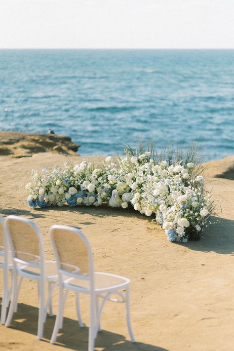 One of the top floral trends we're seeing for 2023 is a grouneded arch or ceremony nest. Head to the blog for more detials and other floral trends predicted by San Diego Wedding Florist Le Champagne Projects. #weddingflowers #weddingflowerinspiration #groundarch #groundedarch #ceremonyflowers #weddingceremonyinspiratoin #2023weddingtrends #weddingflowertrends Low Ground Arch Flowers, Flower Nest Wedding, Floral Nest Wedding Ceremony, Wedding Floral Trends 2023, Ceremony Nest, Beach Wedding Florals, Grounded Arch, Malibu Elopement, 2023 Weddings