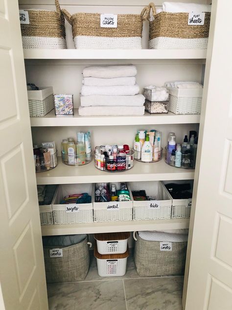 Toiletries Organization Closet, Toiletries Closet Organization, Bathroom Hall Closet Organization, Neutral Bathroom Organization, Bathroom Cubby Organization, Walk In Coat Closet Organization, Bathroom Closet Organization Storage, Small Hallway Closet Organization, Organize Hall Closet