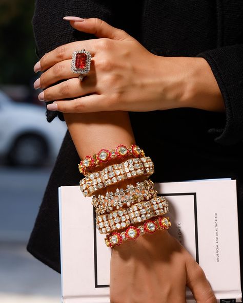 Elevate your style with these stunning 3 pairs of polki bangle sets and a bold ring! First up, the ethereal polki “Gajra” duo, stacked with the charming pair of polki bangles adorned with floral designs delicately crafted in 14 K gold. And finally, the pièce de résistance - our handcrafted Pacheli bangle pair, meticulously fashioned in 18kt gold, embellished with radiant rubies, dazzling polkis, and petite diamonds for that extra sparkle. The mesmerizing red of tourmaline pink stone ring in ... Pacheli Bangle, Polki Bangles, Pink Stone Ring, Bridal Jewellery Inspiration, Pink Stone Rings, Bold Rings, Jewellery Inspiration, Fine Jewels, Bridal Jewellery