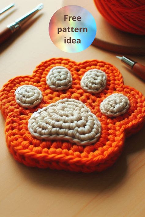 Learn how to make an adorable crochet paw print coaster with this easy and creative tutorial. Perfect for protecting your table with charm! Crochet Paws Pattern Free, Paw Print Coaster Crochet Pattern Free, Crochet Dog Paw Pattern Free, Cat Paw Crochet Pattern, Paw Crochet Pattern Free, Crochet Paw Print Pattern Free, Paw Print Crochet, Crochet Paw Print, Paw Crochet