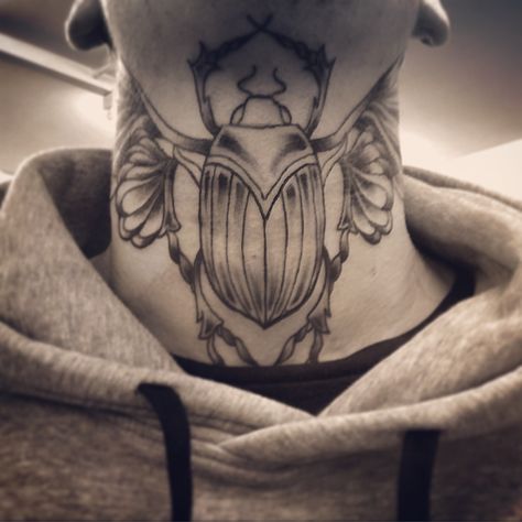 Egyptian scarab beetle throat / neck tattoo Scarab Neck Tattoo, Beetle Neck Tattoo, Egyptian Symbol Tattoo, Scarab Beetle Tattoo, Scarab Tattoo, Conscious Art, Egyptian Scarab Beetle, Egyptian Beetle, Beetle Tattoo