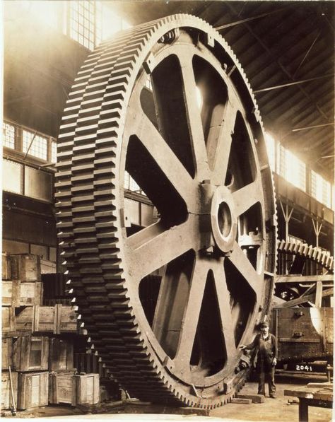 Mesta Machine Company employee stands next to a molded staggered tooth gear at the company's West Homestead facility, 1913. Industrial Prints, Carnegie Museum Of Art, Jet Age, Industrial Machinery, Industrial Machine, Old Factory, Industrial Photography, Machine Shop, Industrial Revolution