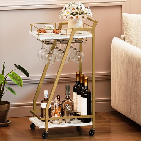 PRICES MAY VARY. Multifunctional Bar Cart: This snack gold bar cart measures 11.8"D x 15"W x 32.1"H and can serve as a serving cart in bars or restaurants, a food or drink cart in the dining or living room, or a mobile beverage cart for parties. One cart for any occasion Double Storage: The home bar cart features 2 spacious storage levels with guardrails to prevent items from falling accidentally. This gold bar cart also includes a wine rack and glass holder that can hold up to 3 bottles of wine Small Bar Cart, Bar Cart Gold, Cocktail Cart, Gold Cart, Cocktails Cart, Beverage Cart, Snack Cart, Bar Serving Cart, Nyc Apt