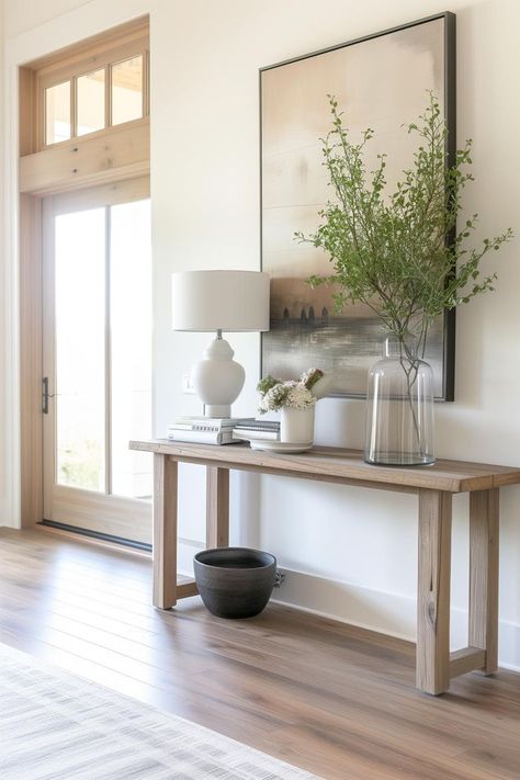 Wood narrow console table next to front door in a modern entryway Hall Tables Ideas, Entryway Console Table Ideas, Narrow Hallway Ideas Entryway, Long Narrow Entryway Ideas, Narrow Hallway Decorating Ideas, Narrow Console Table Entryway, Small Entryway Decor, Entryway Table Styling, Simple Console Table