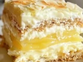 No-Bake Bliss: Easy Lemon Éclair Cake Recipe - NewsBreak Lemon Eclair, Easy Blueberry Bread, Icebox Pies, Eclair Cake Recipes, Custard Cake Recipes, No Bake Pie, Almond Pound Cakes, Eclair Cake, Chocolate Sheet Cake