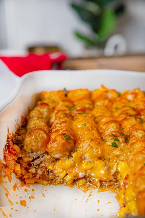 Cowboy Casserole is an easy weeknight family dinner with ground beef, corn, cheddar cheese and sour cream topped with crispy tater tots. Ground Beef And Corn, Cowboy Casserole Recipe, Dinner Ideas With Ground Beef, Ideas With Ground Beef, Weeknight Family Dinner, Cowboy Casserole, Kung Pao Chicken Recipe, Yummy Casserole Recipes, Chicken Casserole Easy