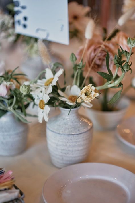 Reception table at Altadena Country Club with glazed pottery with wildflower centerpieces #losangelesweddingplanner #natureinspiredwedding Pottery Centerpieces Wedding, Ceramic Wedding Centerpiece, Ceramic Centerpieces Wedding, Pottery Centerpieces, Wedding Pottery, Simple Table Centerpieces, Hanging Floral Installation, Bud Vases Wedding, Bud Vase Centerpiece