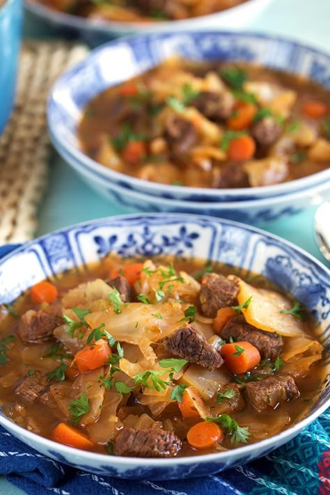 Close up of Beef Cabbage Soup in a blue and white bowl. Beef Stew With Cabbage Recipe, Soup Recipes Cabbage, Stew With Cabbage, Cabbage Soup Crockpot, Cabbage Beef, Recipes Cabbage, Beef Cabbage Soup, Easy Stuffed Cabbage, Sweet And Sour Cabbage