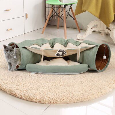 The cat tunnel features two in one function, including large hide tunnel, comfy cushion bed as well as scratching toy on each side. It can hold up 2 or 3 cats, allowing them play with each other together. This tunnel for indoor cats, made of premium plush fabric, is durable and scratch resistant, preventing damage from your naughty kitten’s claws. Full PP cotton cushion mat makes it comfortable for rest and warm in cold weather. And its rapid-drying function makes it be with your cat for a long Cat Products For The Home, Luxury Cat Tree, Katt Grejer, Play Tunnel, Outdoor Cat Enclosure, Cat Tent, Cat Cage, Cat Furniture Diy, Furniture Scratches