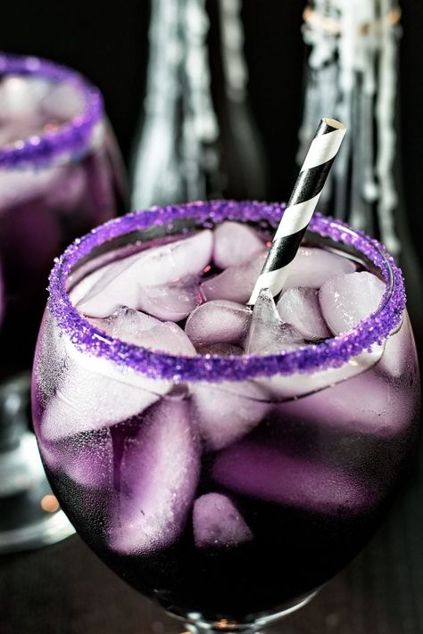 Purple People Eater Cocktail! A tasty (and creepy!) cocktail that gets its purple hue from blue curacao, grenadine, and cranberry juice. A perfectly purple cocktail for any party! | HomemadeHooplah.com Purple Drink, Purple People Eater, Vegan Drinks Recipes, Purple Cocktails, Purple Drinks, Purple People, People Eater, Homemade Cocktails, Gourmet Sandwiches