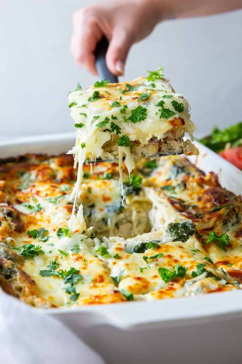 This White Chicken Lasagna is layered with a creamy spinach white sauce and baked until tender and golden brown. This easy chicken lasagna recipe utilizes store-bought rotisserie chicken and is a delicious make-ahead meal! Easy Chicken Lasagna Recipe, Baked Chicken Pasta Recipes, Chicken Lasagna Recipe, White Chicken Lasagna, Cheesy Chicken Casserole, Chicken Pasta Casserole, Cheesy Chicken Pasta, Pasta Casserole Recipes, White Sauce Recipes