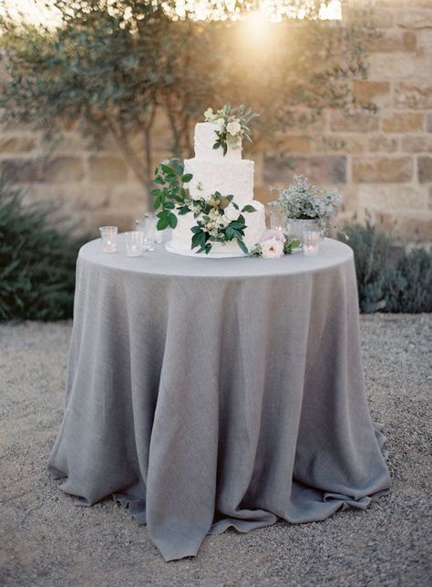 simple white three tiered cake with cascading foliage The Vault: Curated & Refined Wedding Inspiration - Style Me Pretty Sunstone Vineyard Wedding, Grey Wedding Theme, Gray Wedding Colors, Natural Linen Tablecloth, Wedding Theme Inspiration, Wedding Table Linens, Cake Table Decorations, Theme Inspiration, Wedding Cake Table