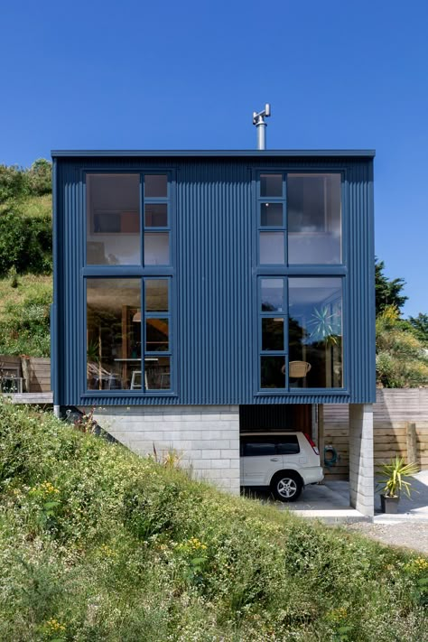 Photo 5 of 23 in This Compact New Zealand Home Uses Low-Cost Materials to Dazzling Effect - Dwell Steel Homes, New Zealand Home, Small Architecture, Modern Residential Architecture, Interior Shutters, New Zealand Houses, Metal Siding, Awesome Architecture, Wellington New Zealand