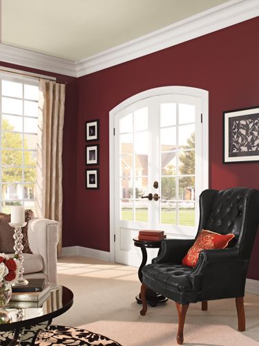 A deep hue—Behr's Twinberry—adds depth to the walls without going overboard. Modern Paint Colors, Bibliotheque Design, Red Living, Living Room Red, Room Paint Colors, Red Rooms, Paint Colors For Living Room, Red Walls, Living Room Colors