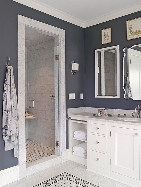 Even the smallest bathroom can accommodate bounteous style. Though diminutive in dimension, this walk-in shower makes an impact thanks to its marble door frame and tiled interior, which are highlighted by charcoal walls. http://www.bhg.com/bathroom/shower-bath/walk-in-showers-for-small-bathrooms/?socsrc=bhgpin042015charcoalbathroom&page=3 Color Bathroom Design, Makeover Kamar Mandi, Gray Tile, Small Bathroom With Shower, Coastal Bathroom, Coastal Bathrooms, Small Bath, Subway Tiles, White Vanity