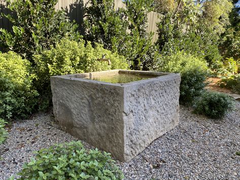 This antique French limestone trough from @eyeofthedaygdc converted into fountain with antique spout with pittosporum “golf ball” in pea gravel Limestone Trough Fountain, Farmhouse Gardens, Limestone Trough, Limestone Fountain, Stone Trough, Curb Appeal Landscape, Fountain Ideas, Backyard Renovation, French Limestone