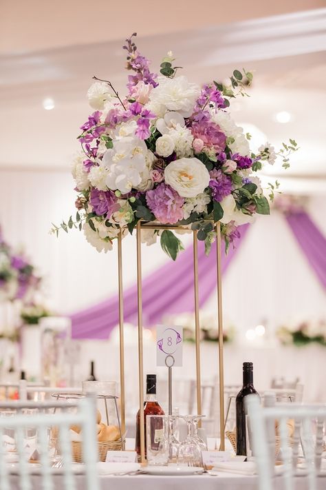 Gorgeous purple and white mixed floral centerpiece for a romantic purple wedding. Purple Gold And White Centerpieces, Pink Purple White Wedding Decor, Purple And White Flower Centerpieces, Purple And White Wedding Decorations, Purple Decorations Wedding, Purple Quinceanera Centerpieces, Purple Quince Centerpieces, Quince Centerpieces Flowers, White And Purple Wedding Theme