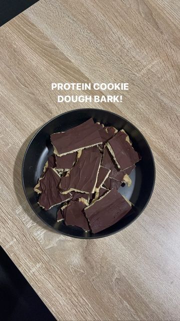 Brooke Neal on Instagram: "PROTEIN COOKIE DOUGH BARK. Wowow this may be the best dessert recipe I’ve ever made. This will make grabbing a healthier option super simple this week when I’m craving something sweet! Protein I use: @arbonne Chocolate chips I use: @enjoylifefoods Make it + let me know what you think 🍫👩🏼‍🍳🍪😍✨" Arbonne Cookie Dough Recipe, Cookie Dough Bark Healthy, Viral High Protein Cookie Dough Bark, Protein Chocolate Bark, Protein Bark Recipe, Cookie Dough Bark Recipe, High Protein Cookie Dough Bark, Protein Cookie Dough Bark, Shaklee Recipes