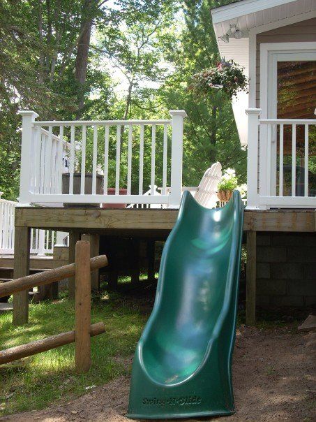 Slide off the side of the Lake House deck (family cottage on Lake Michigan) - my photo.....only mod it so us grown ups can go down it too! (bahahaha this is a fantastic idea!!!) Deck With A Slide, Slide On Deck, Backyard Lake Ideas, Slide Off Deck, Tall Decks, Deck With Slide, Tree House With Slide, Lakeside Patio, Lake House Deck