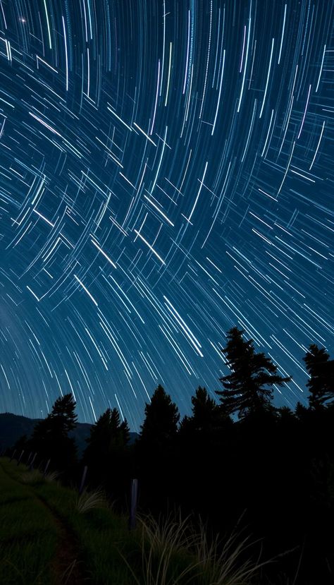 Star TrailsStar trails, captured through long-exposure photography, create beautiful streaks of light in the night sky. These mesmerizing images reveal the Earth's rotation and showcase the beauty of celestial movements. Ideal for photography boards, star trails inspire others to explore creative techniques in capturing the wonders of the universe. Long Exposure Stars, Star Trails Photography, Earth's Rotation, Earths Rotation, Star Photography, Long Exposure Photography, Star Trails, Exposure Photography, Falling Stars