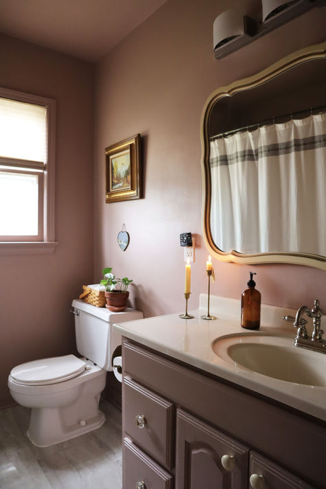 Bathroom vanity makeover in mauve color and cream counter