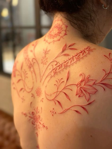 Red Ink Vine Tattoo, Red Tattoos For Black Women, Aztec Back Tattoo Women, Minimal Lower Back Tattoo, Red Feminine Tattoo, Red Vines Tattoo, Spine Tats Red Ink, Pretty Red Tattoos, Coloured Fine Line Tattoo