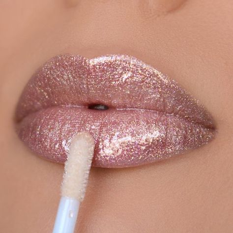 Say hello to our new Bella Luxe lippies! This non sticky gloss formula adds the perfect pop of color to your lips, from an everyday look to a buildable bold one. Grab one or all 12 new shades and use hashtag #BellaLuxe when you upload a picture so we can share! BELLA LUXE LIPGLOSS DELIVERS A ULTRA RADIANT AND CREAMY FINISH WITH GLITTER FLAKES ON SOME SHADES. GLIDES ON EASILY AND CAN BE APPLIED ON BARE LIPS OR AS A TOPPER INGREDIENTS: PLOYISOBUTENE, ETHYLHEXYL PALMITATE, MINERAL OIL, OCTYLDODECANOL, SILICA DIMETHYL SIYLATE, GLYCERYL BEHENATE/EICOSADIOATE, BIS-DIGLYCERYLMPOLYACYLADIPATE-2, PHENOXYETHANOL, PROPYLPARABEN, BHA, CALCIUM SODIUM BOROSILICATE, QUARTZ, SYNTHETIC FLUORPHLOGOPITE, TIN OXIDE. Metallic Liquid Lipstick, Shimmer Lipstick, Everyday Makeup Tutorials, Glitter Lip Gloss, Lip Gloss Collection, Bare Lip, Lip Gloss Colors, Beauty Creations, Glitter Lips